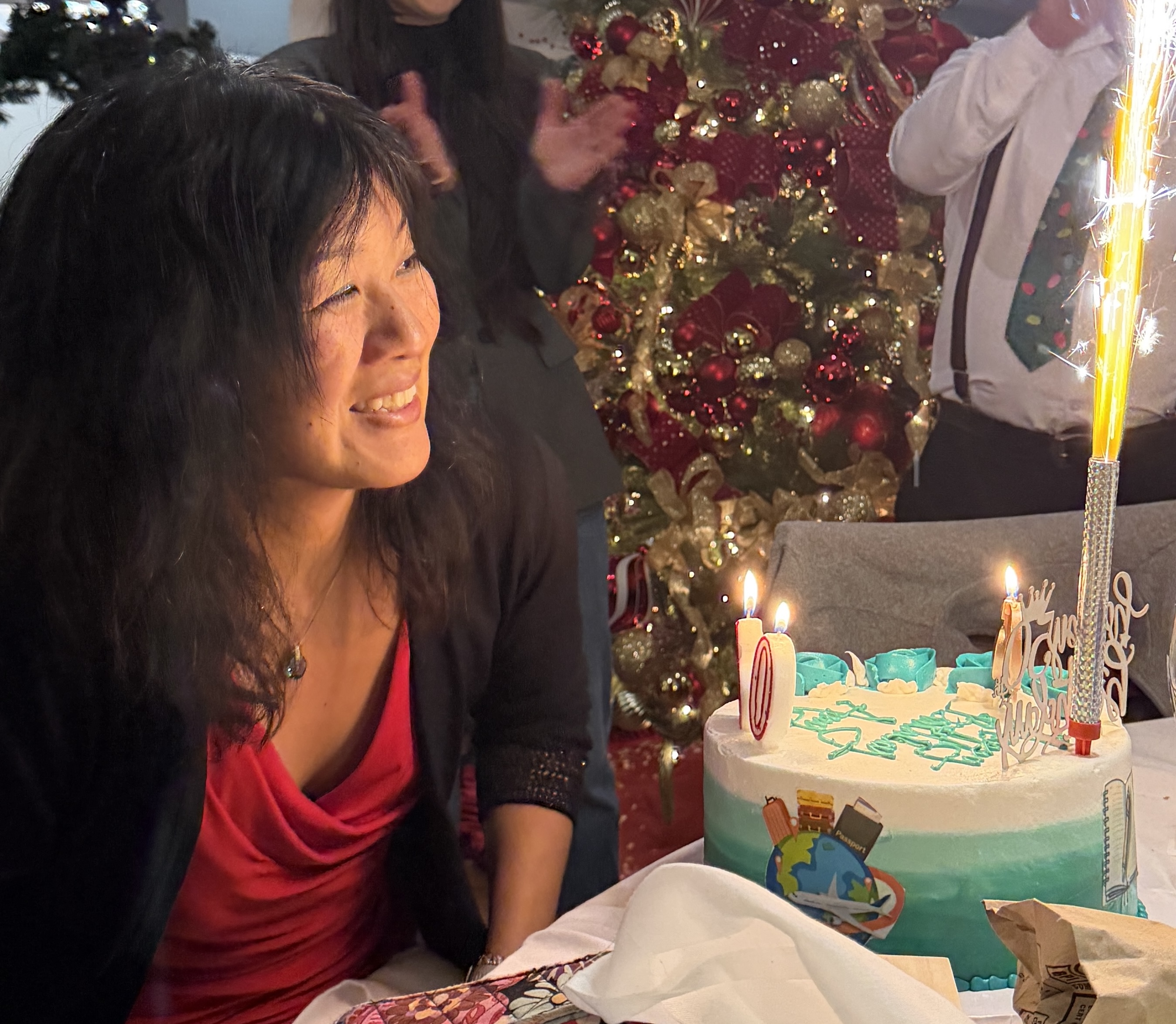 Amy Wu smiling with her 50th birthday cake